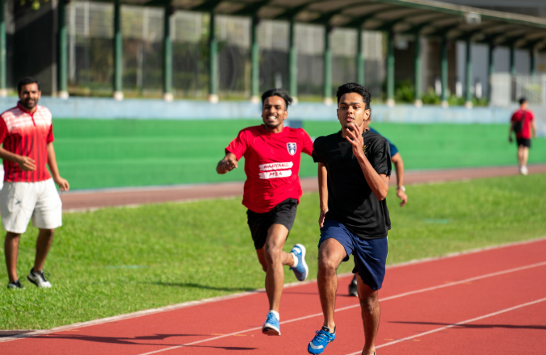 Nihel Jaison (right), SP Jain’s MGB student, on his way to gold in the Men’s 100m race